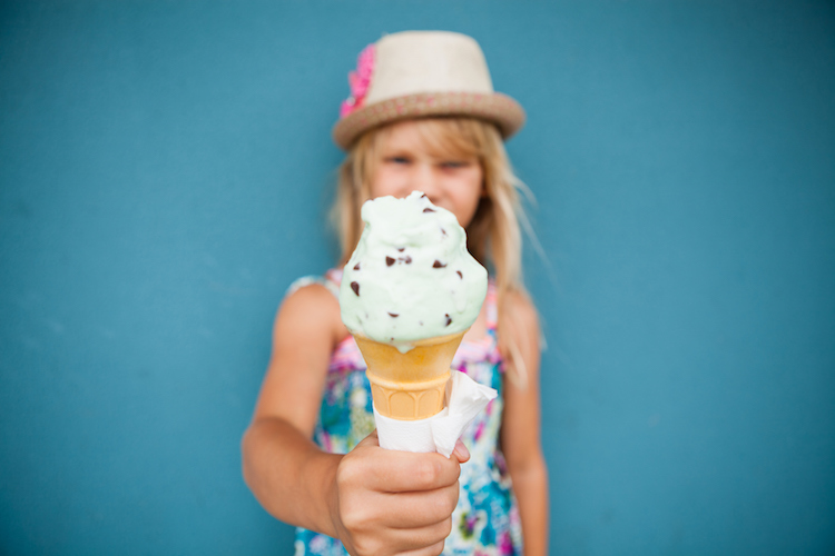 Ice cream cone held by young girl