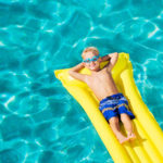 Young Kid Having Fun in Swimming Pool