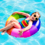 Child with toy ring in swimming pool