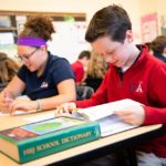 girl boy reading at desk