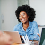 portrait young african american girl woman smiling office classroom