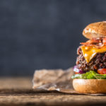 Close-up home made beef burger on wooden table