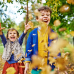 Brother and Sister in Autumn Park