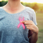 woman holding pink ribbon breast cancer awareness. concept healthcare
