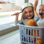 Kids rides in a laundry basket