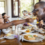 Guests having breakfast at hotel restaurant