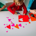 kids making hearts from paper, prepare for valentine day