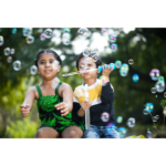 Kids blowing bubbles