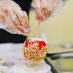 The process of making caramel apples