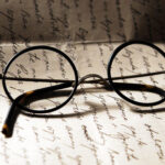 Old glasses on a letter