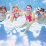 family  in swimming pool