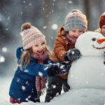 Children build snowman in falling snow