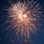 Stars of the fireworks are on a dark blue background
