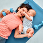 A sports mother is engaged with the child in fitness and yoga at