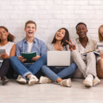 Group of happy students studying for university exams