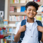 Smiling hispanic boy at school