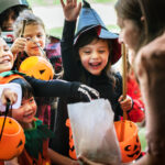 Little children trick or treating on Halloween