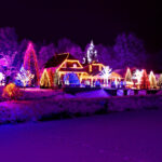 Christmas fantasy – park, forest & lodge in xmas lights