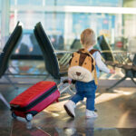 Children, traveling together, waiting at the airport to board the aircraft