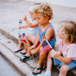 Cute American Kids watching Fourth of July Parade