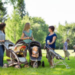 Happy Mothers With Baby Strollers
