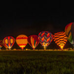 Hot air balloons during a night glow at a balloon festival in Grants Pass Oregon